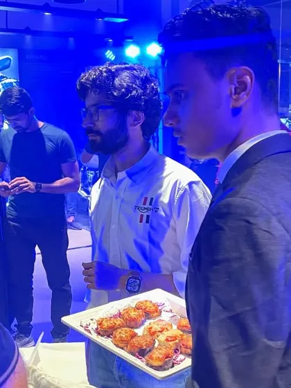 Our staff serving freshly made appetizers to guests at the Triumph showroom launch. We ensure prompt and professional service, even in a busy event environment.