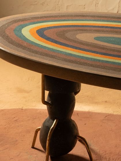 The colorful, layered rings of the Weavers Ant Table's terrazzo surface. Each color is poured by hand to create this stunning, one-of-a-kind pattern inspired by natural strata.