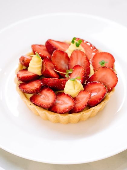 Our individual strawberry and crème pâtissière tart is a perfect single-serving treat. The buttery crust is filled with rich cream and topped with juicy, sun-ripened strawberries.