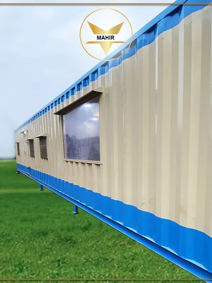 This 40-foot container, featuring an office, pantry, and bedroom, is shown installed on-site. We can place our structures on various foundations, including stilts like these, which are ideal for uneven terrain or specific site requirements.