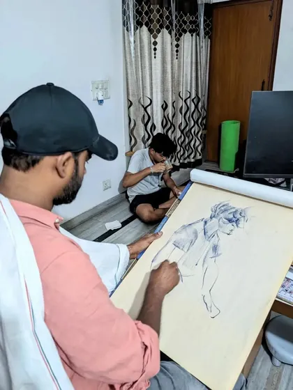 Continuing the live demonstration, I am refining the figure's form and adding details to the sketch. This process helps students see how a drawing is built up from simple lines to a more complete figure.