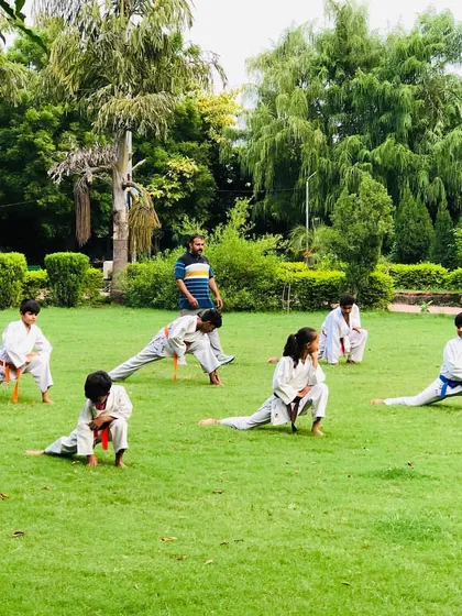 An outdoor training session in the park. We use the open space to work on foundational strength and flexibility, building a strong body and a disciplined mind.