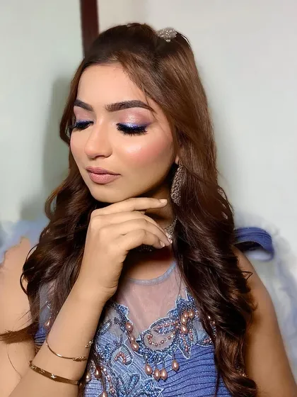 A close-up of the Barbie look. The focus is on the shimmery lilac and blue eyeshadow, creating a dreamy and magical effect.