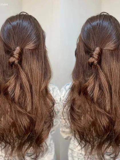 A cute half twist style on this lovely brown hair, showing its texture and shine.