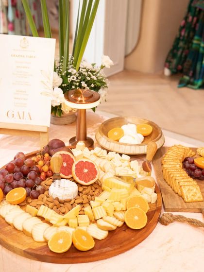 A bright and fresh grazing table for the GAIA brand launch. The spread is filled with citrus fruits, grapes, almonds, and a variety of cheeses, reflecting the vibrant energy of the event.