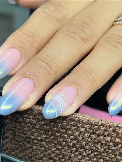 Blue bliss! This design features a pink and blue ombré with a chrome finish and abstract line art.