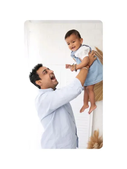 A father joyfully lifts his baby into the air. These dynamic, action-filled shots add a sense of fun and energy to your family gallery.
