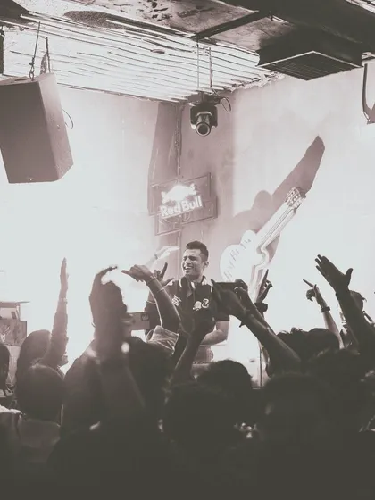 A vintage-style shot of the crowd with their hands up at Club Barocks, Kolkata.