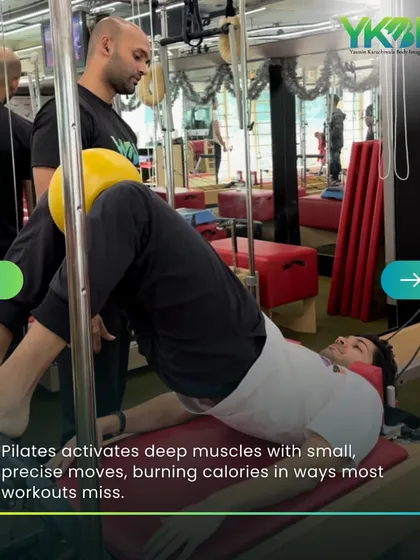 Pilates activates deep muscles with small, precise moves, burning calories in ways that most other workouts miss. This client is working his core with a stability ball on the Cadillac.