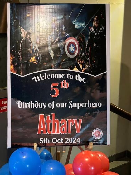 A personalized welcome sign for the 'Superhero Atharv', setting the stage for an epic 5th birthday party right from the entrance.