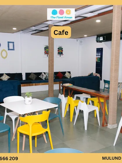 A look at our cozy and colorful cafe space. It's the perfect spot to relax, enjoy a meal, and watch the fun happening in the pool.