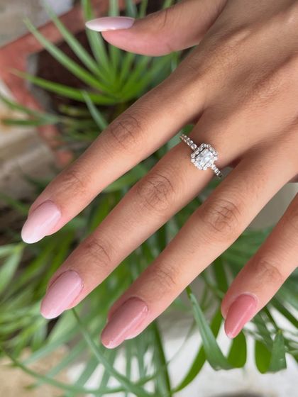 A close-up of the multi-tonal pink and nude dip powder manicure, showing the seamless transition between shades on each nail.