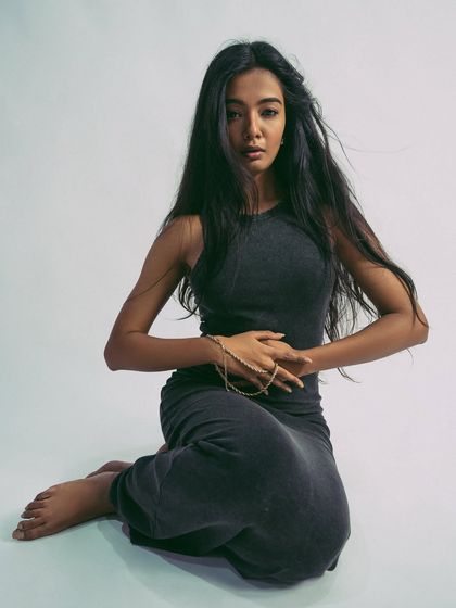 Another strong seated pose that shows the model's versatility.