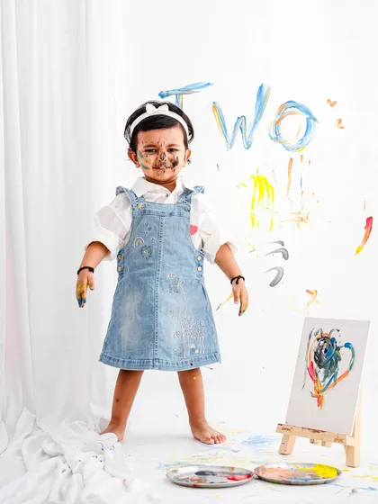 Let them be little and let them be messy! This fun paint-splatter theme for a second birthday shoot is all about capturing the pure, uninhibited joy of childhood creativity.