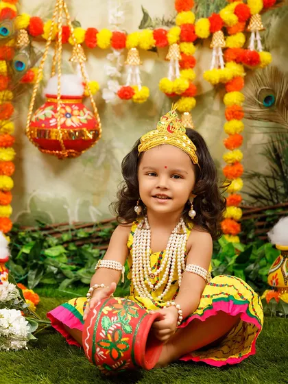 A beautiful example of a little girl dressed as Radha, showing the quality of the costumes I provide.