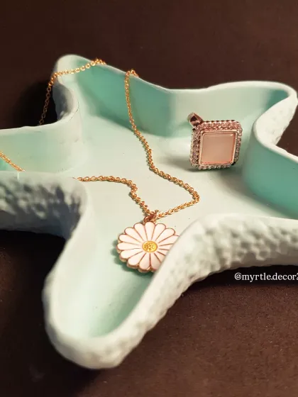 A close-up of our teal starfish trinket tray, a perfect piece for anyone who loves coastal-inspired decor.