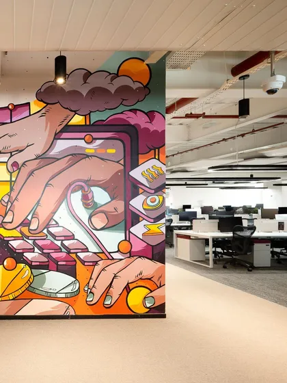 The mural integrated into the office hallway, creating a dynamic visual journey for employees and visitors.