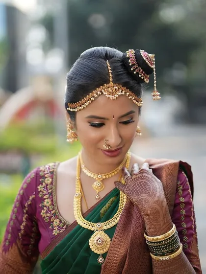 A close-up of the bride's makeup and hair. The focus is on clean lines, from the winged eyeliner to the neatly pinned updo, reflecting my precision-focused approach.