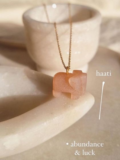 A collection of my moonstone pendants. The Peach Moonstone elephant is for abundance and luck.