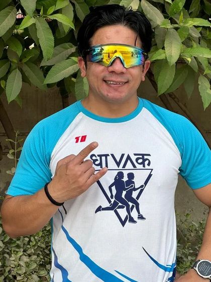 A participant in our 'Dhavak' t-shirt, looking energized during a training run. Our custom gear helps build a strong sense of team identity.