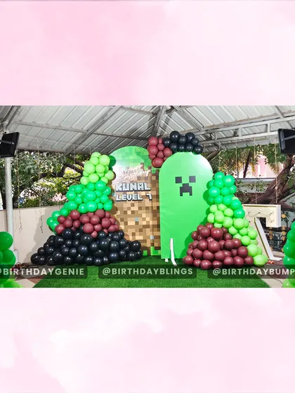 The Minecraft backdrop before all the characters were added, showing the foundational design with the Creeper panel and balloon arrangements.