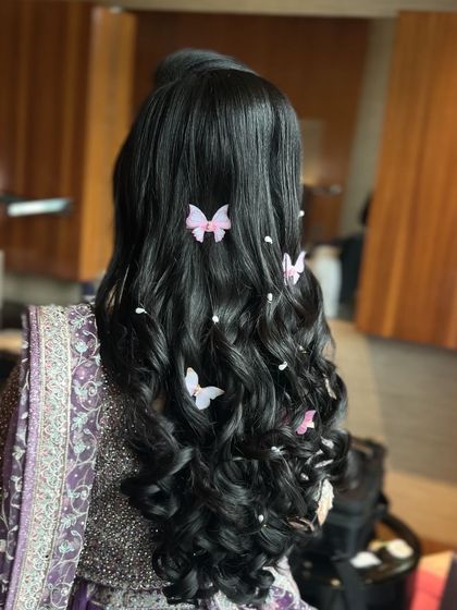 A clear back view of the enchanting butterfly and pearl hairstyle.