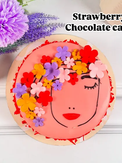 Celebrate the amazing women in your life with our special Strawberry Chocolate cake. This beautifully decorated cake features a delicate floral design on a rich, flavorful base, making it the perfect centerpiece for Women's Day.