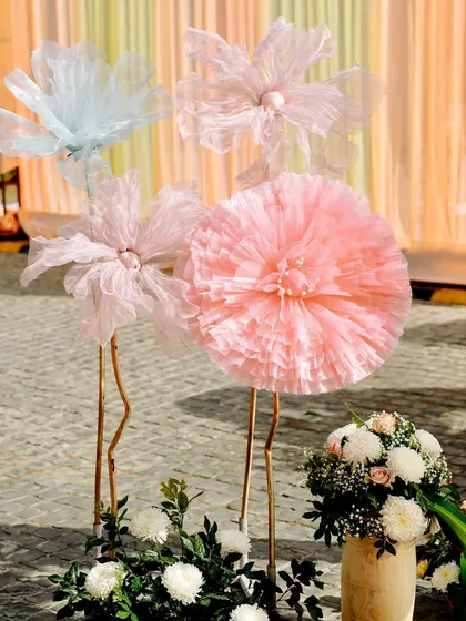 A close-up of the whimsical, oversized fabric flowers that were a key element of this unique Haldi decor.