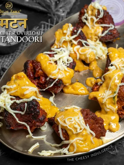 For the mutton lovers, our Mutton Cheese Overload Tandoori. Tender, spiced mutton pieces are grilled in the tandoor and then smothered in a creamy cheese sauce and extra shredded cheese.