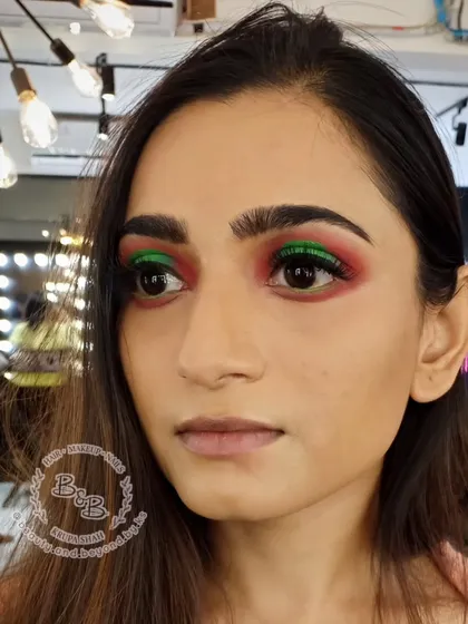 For clients who love color, I create looks like this vibrant halo eye. By placing a bright pop of green in the center of the lid surrounded by a contrasting red, the eyes look bigger and more dimensional. This is a great way to make a bold statement for a special event or creative shoot.