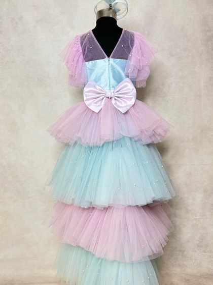This mermaid-themed outfit is designed for both style and play. It features a beautiful playsuit with a detachable tiered tulle trail, allowing for a grand entrance and the freedom to party comfortably.