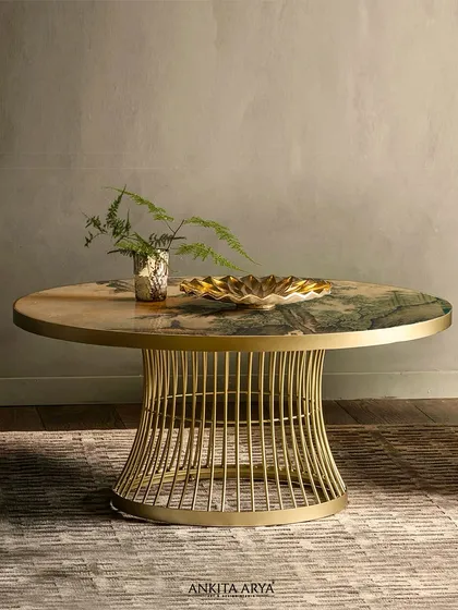 Art doesn't have to hang on a wall. This center table features an exquisite landscape design printed directly onto its glass surface, merging modern luxury with timeless artistry to create a sophisticated focal point.
