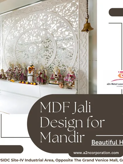 An MDF jali design created for a mandir backdrop. The intricate white jali panel provides a beautiful, detailed screen for a home temple, allowing for creative lighting and adding a layer of traditional artistry to the sacred space.