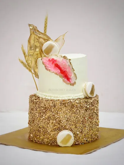 A two-tier geode cake with gold sequins, another advanced technique taught in my workshops.