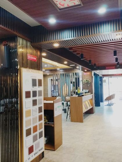 This view shows our sample stands, where you can examine smaller pieces of different wall panels up close to check their texture and quality.