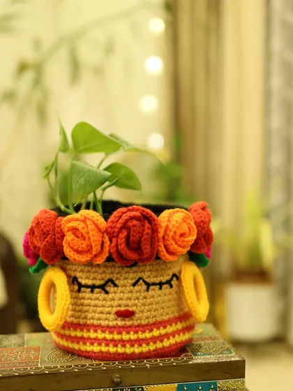 Another angle of the vibrant Frida Basket. The design includes her signature floral crown and little yellow hoop earrings, adding to its unique character.