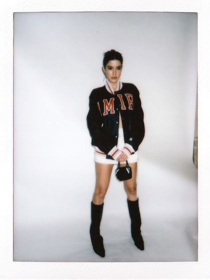 An instant film shot of Shanaya Kapoor, capturing the cool, effortless vibe of her Amiri jacket look in the studio.