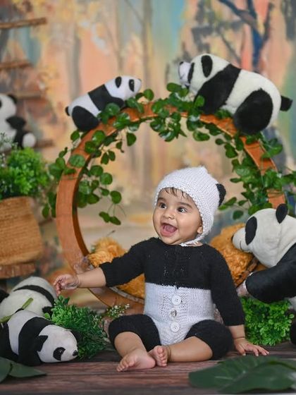 A full view of the panda setup, showing the forest backdrop and all the cute panda props.