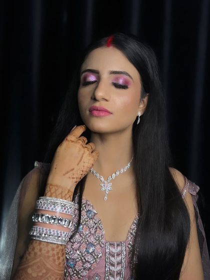 Another shot of the reception look, with the bride's eyes closed to show the full effect of the eyeshadow.