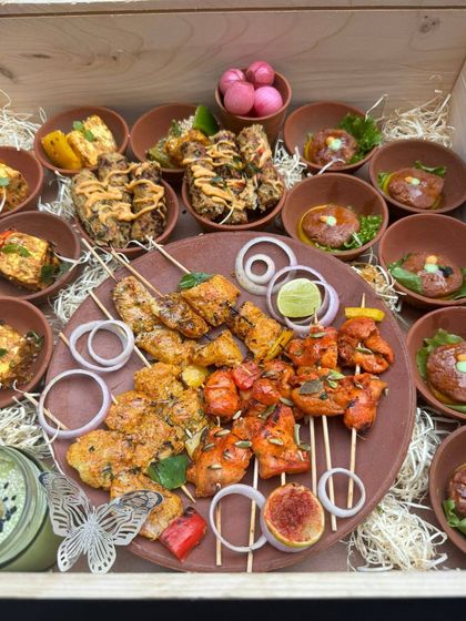 This platter showcases the variety of our Indian appetizers. It features an assortment of kebabs, tikkas, and galoutis, all marinated in signature spice blends and ready to be served at your next party.