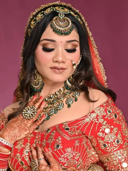 The complete bridal look, with flawless skin, dramatic eyes, and perfectly coordinated jewelry. The makeup enhances her features and completes the stunning bridal ensemble.