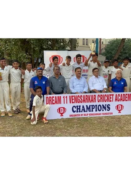 The entire U-14 champion squad with their trophies and the prize distribution committee.