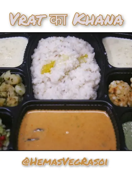 A complete and satisfying meal for Ashadhi Ekadashi. This Vrat ka Khana includes Bhagar with peanut curry, Sabudana Vada, and a refreshing pomegranate and cucumber salad.