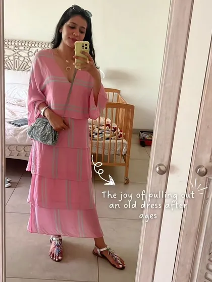 There's a special joy in pulling out an old dress you haven't worn in ages and making it feel new again. This pink tiered dress was perfect for a relaxed day in Goa, paired with simple flat sandals and a small bag.