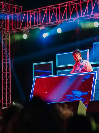 Here you can see the full stage setup with custom visuals on multiple screens. As a VJ and DJ, I deliver a complete sensory experience for festival-goers.
