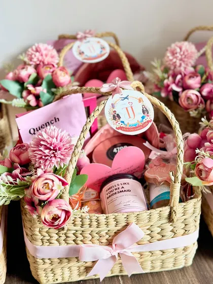 I was so happy to create these proposal baskets for my lovely client. Each one includes a custom scented candle, a mini bottle of white wine, a bridesmaid sash, and lots of other personalized goodies.