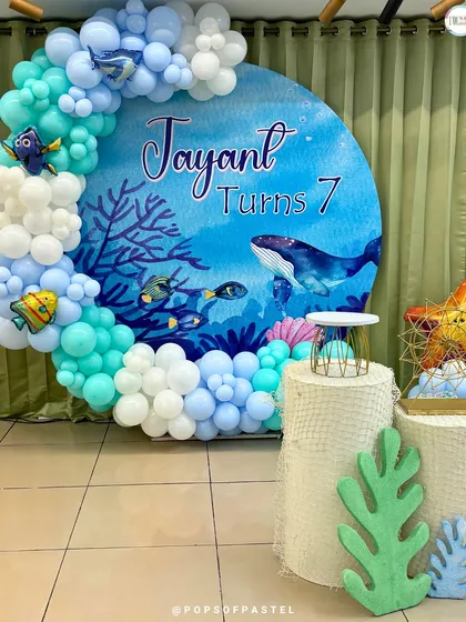 Dive into imagination! We love transforming our studio for special occasions, like this "Under The Sea" themed 7th birthday party. We help you create the perfect backdrop for your celebration.