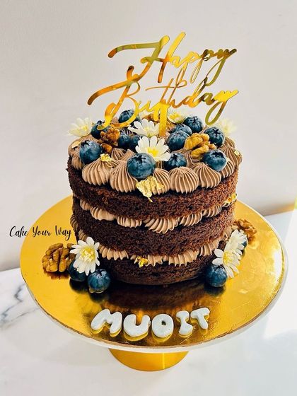 One of my recent favorites. A naked chocolate cake with walnuts, blueberries, and fresh flowers.