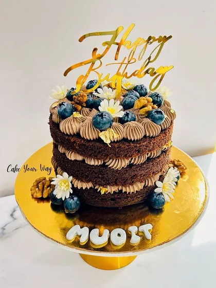 One of my recent favorites. A naked chocolate cake with walnuts, blueberries, and fresh flowers.