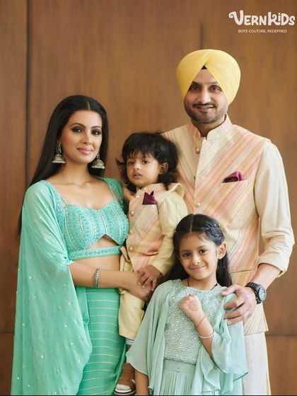 A beautiful family portrait featuring cricketer Harbhajan Singh's son, Jovan, looking sharp in his custom Vern Kids Bundi set.